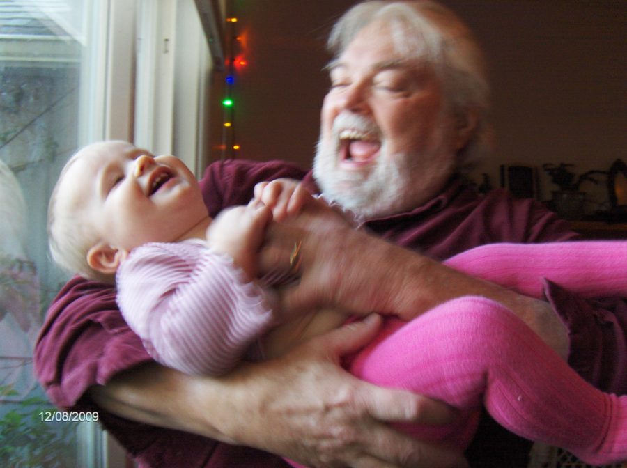 my Dad holding his granddaughter