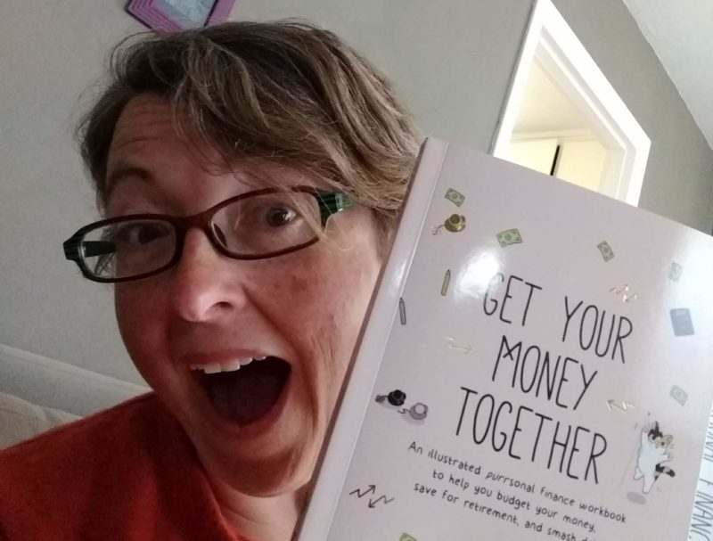 with "Get Your Money Together" book